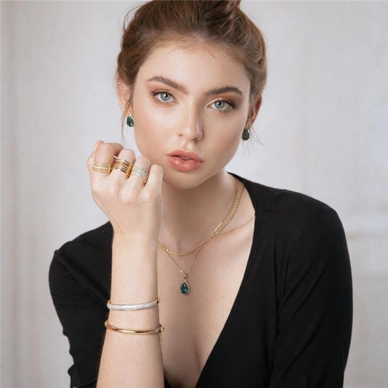 ANEL 7 ELOS COM PEDRAS DE ZIRCÔNIAS CRISTAL FOLHEADO A OURO